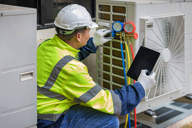 Professional Heat Pump Repair technician working in Winfield, AL